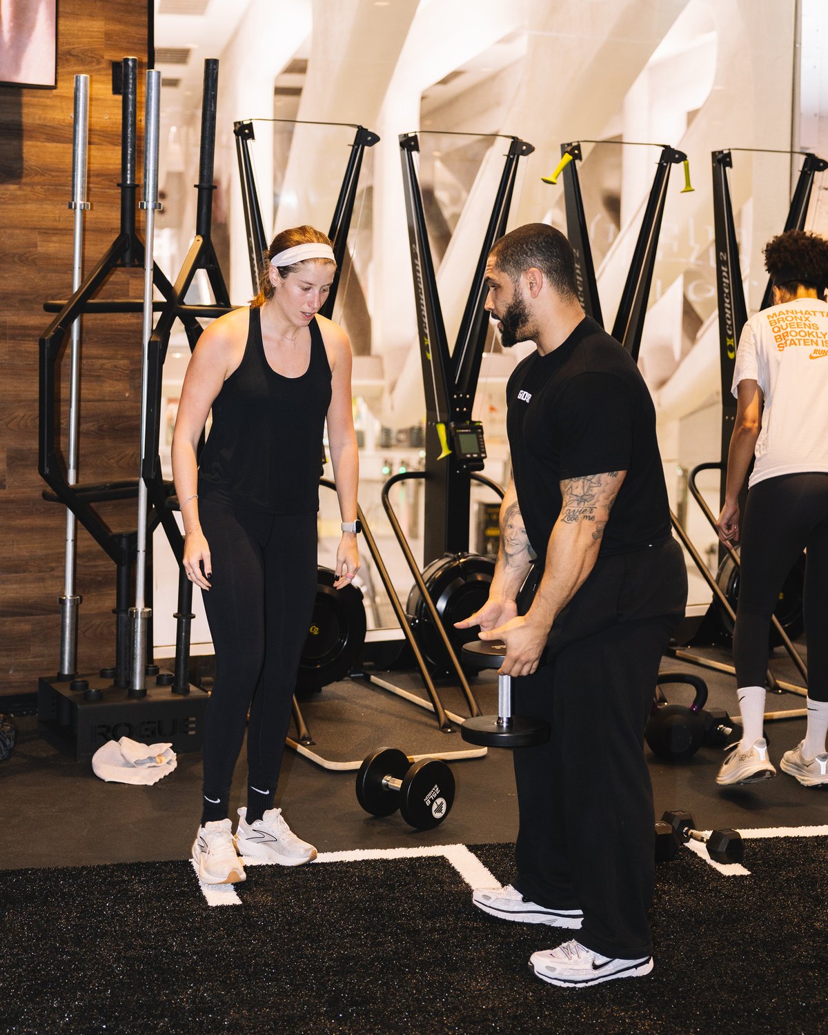 Independent trainer working with a client on the private floor.
