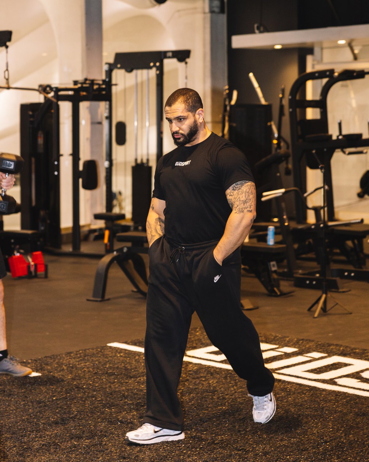 A trainer walking the private floor during a walkthrough.